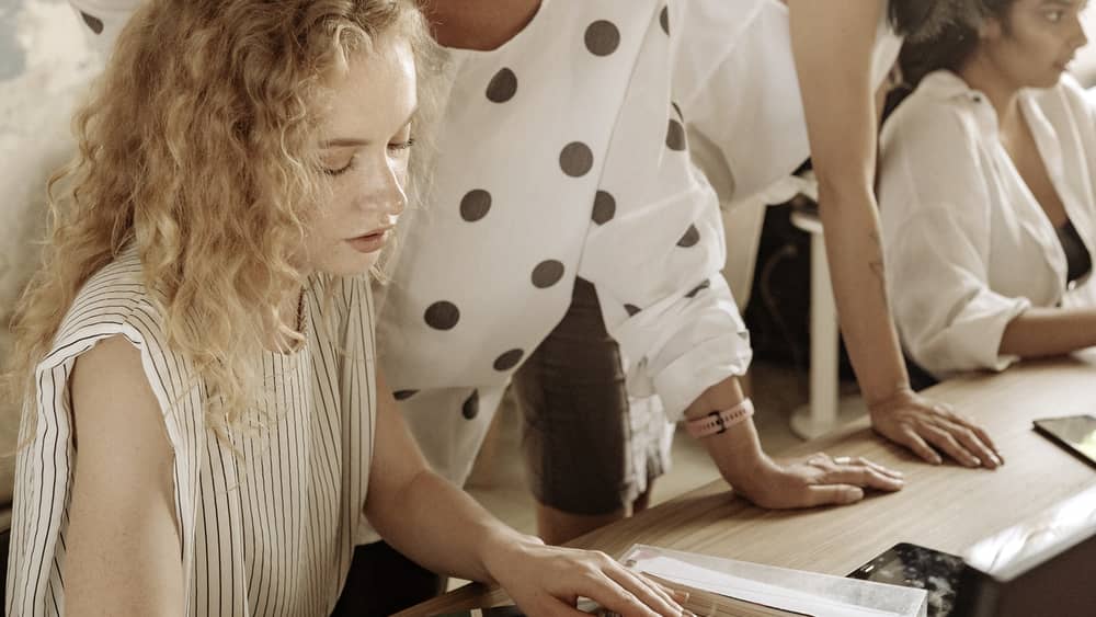 Designers collaborating on colour samples in a modern office