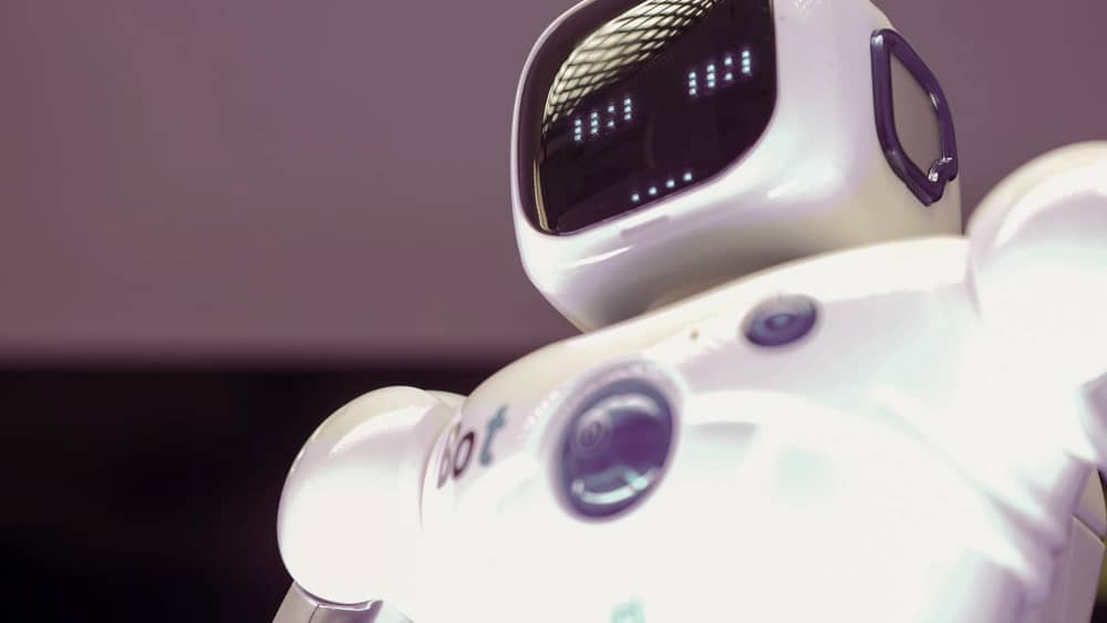 Modern humanoid robot with a luminescent digital display