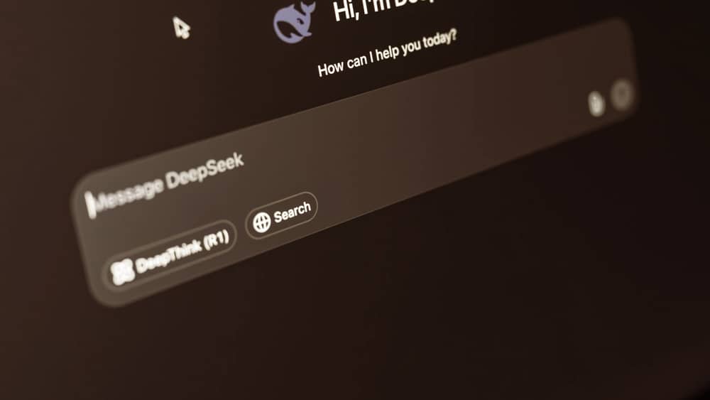 Laptop screen showing an AI chat interface in a dark room