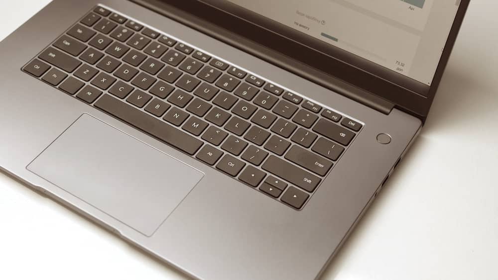 Open laptop on a clean white desk displaying software