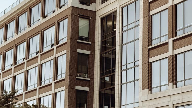 Glass facade of a modern corporate office building